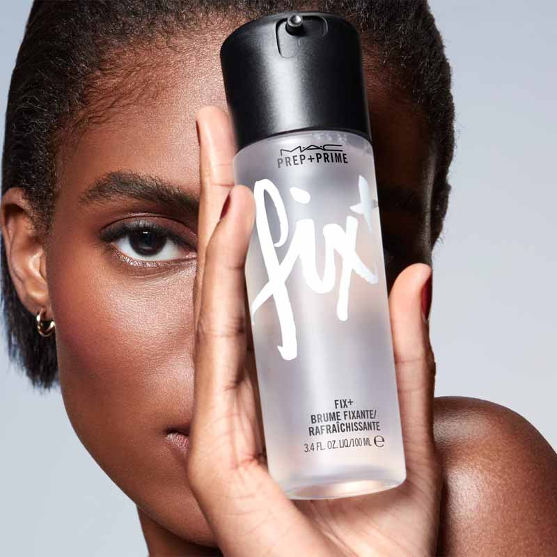 MAC Fix+ Setting Spray on a vanity with makeup brushes