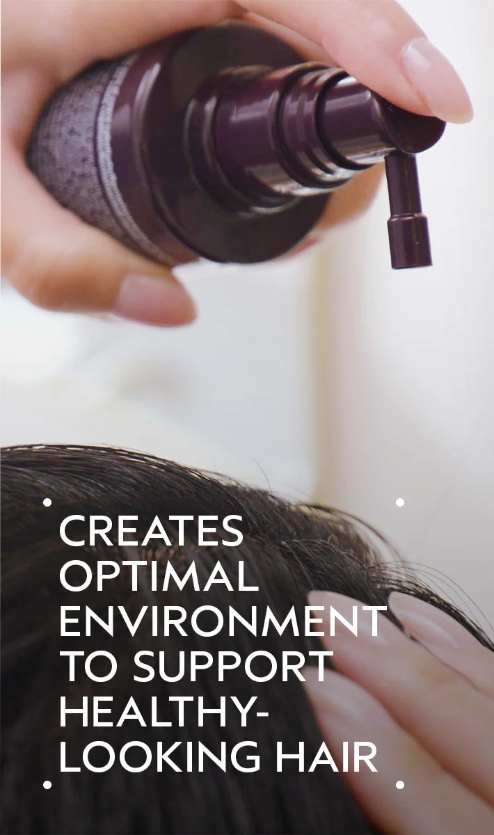 Close-up of serum application using dropper on scalp