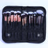 The bag being filled with various makeup brushes (with disclaimer overlay)