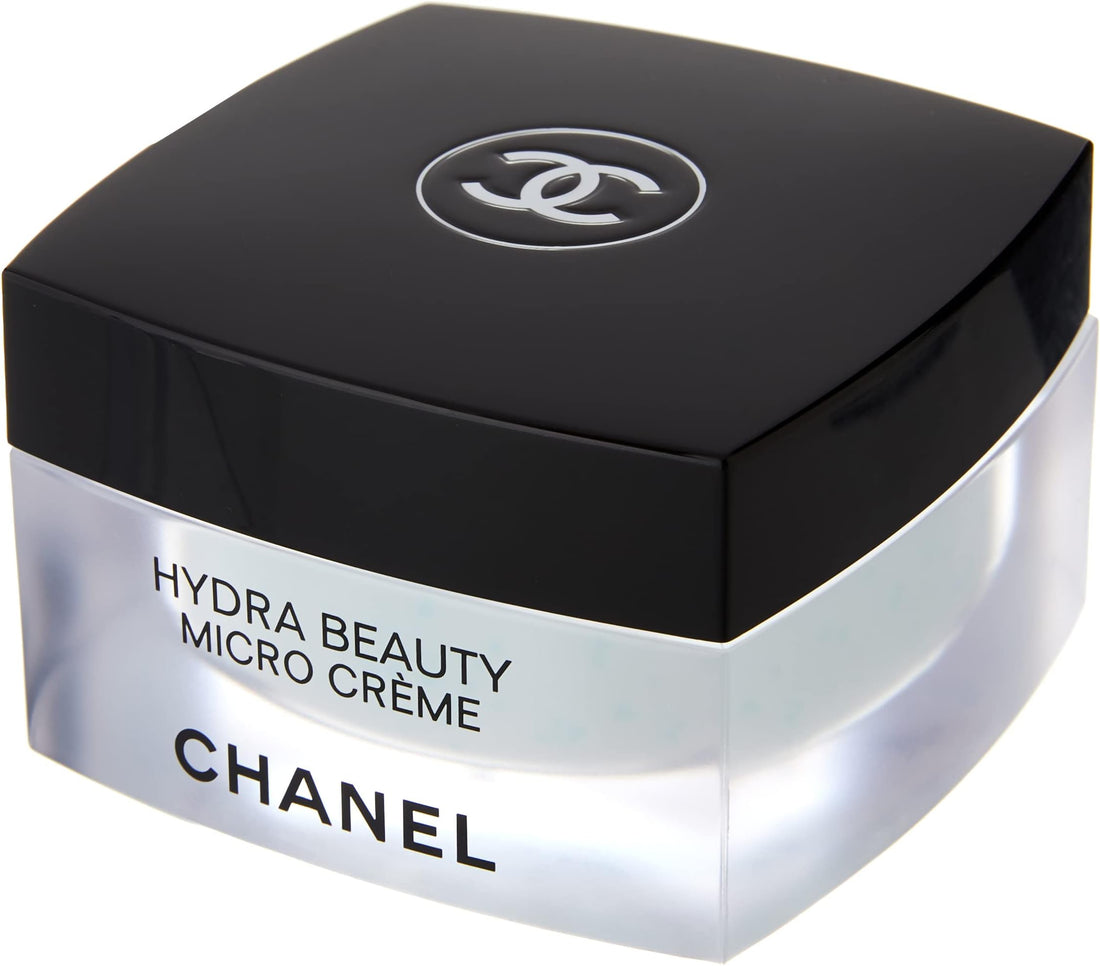 Chanel Hydra Beauty Camellia Micro Crème 50g luxury moisturizer with white camellia flowers on marble surface
